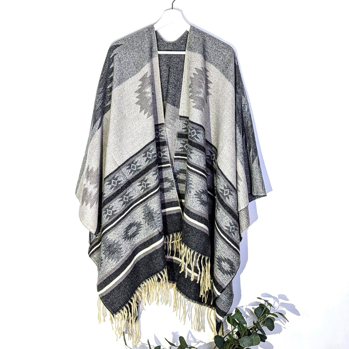Poncho with tassels