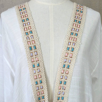 Kaftan with fluted sleeves and pastel embroidery detail and tie