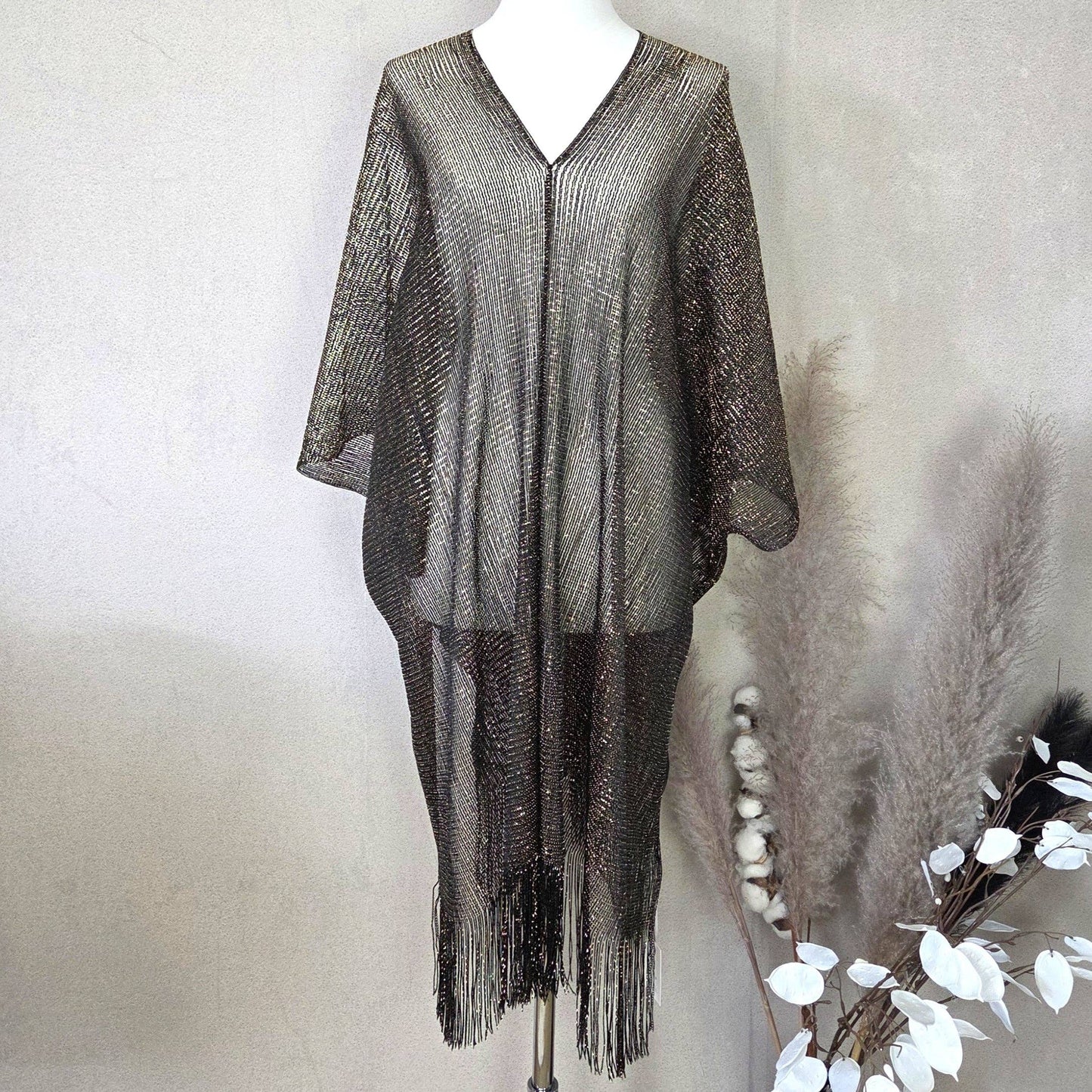 Kaftan with metallic fleck and tassel edge